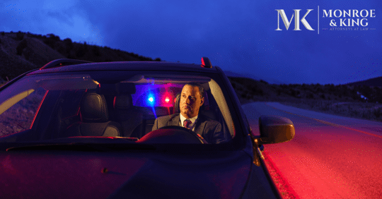 man in suit pulled over by police at night