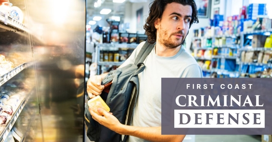 young man who appears to be shoplifting