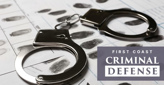 handcuffs over fingerprints