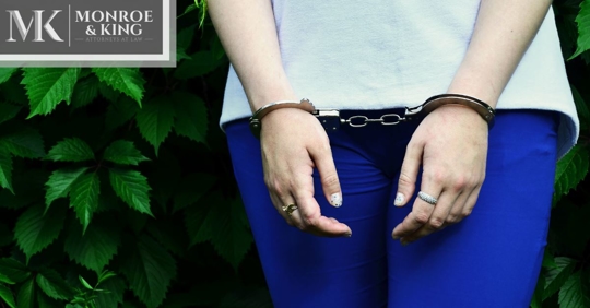 woman's hands in handcuffs
