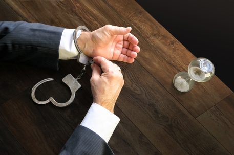 Man opening his own handcuffs