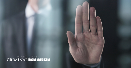 man putting up his hand